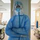 Photo taken on February 16, 2020 shows a medical staff member resting at the isolation ward of the Wuhan Red Cross Hospital in Wuhan in China’s central Hubei province.